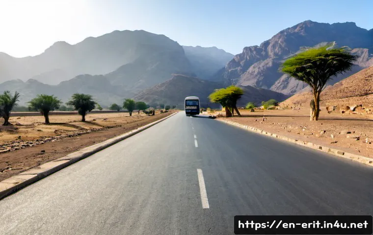에리트레아 도로 환경 - Photorealistic wide-angle view of a paved highway crossing Eritrea’s dry highland landscape, rugged ...